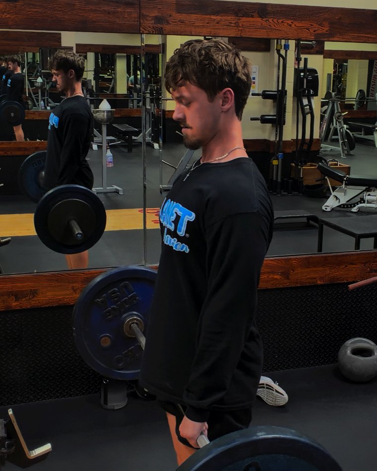 Jacob pressing dumbbells